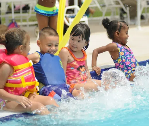kids splashing in pool